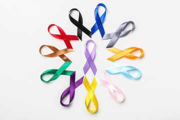 Different colorful awareness ribbons on white background. World Cancer Day