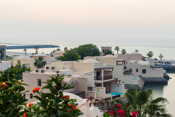 Ras Al Khaimah, UAE - 04.04.2022 - View of the beach and private villas at The Cove Rotana Resort. Holiday