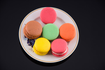 Multi coloured macarons on white