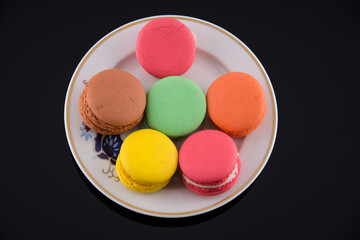 Multi coloured macarons on white