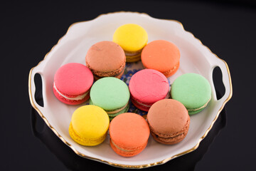 Multi coloured macarons on white