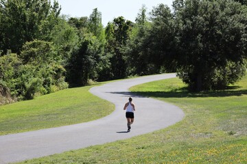 Woman Running Alone on S-Shaped Path