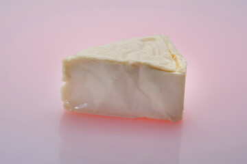 Cheese triangles on a reflective surface,Processed cheese