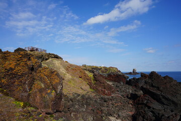 fine rock coast and charming clouds