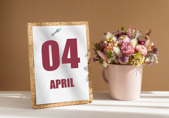 April 4. 4th day of month, calendar date.Bouquet of dead wood in pink mug on desktop.Cork board with calendar sheet on white-beige background. Concept of day of year, time planner, spring month