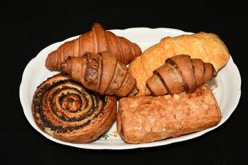 porcelain platter with Croissants, donuts, crullers