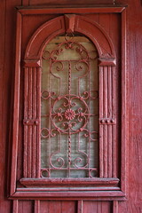 red gate with wrought iron in Bistrita, Romania