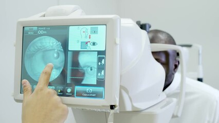 A retinal exam was performed on a man using an optical coherence tomography (OCT) by an ophthalmologist. In 4K