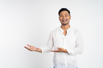 young man with both hands presenting something on isolated background