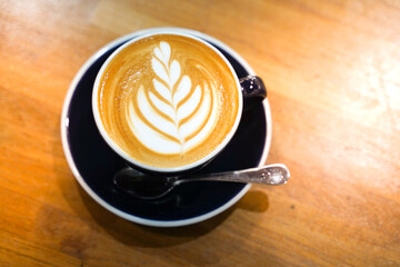 Latte coffee on wood table