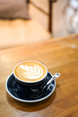 Latte coffee on wood table