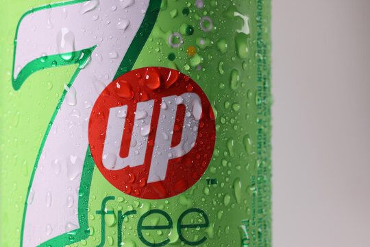 Kuala Lumpur, Malaysia-April 18, 2022- 7up free, sugar free logo on ice cold tin can rotating on white background