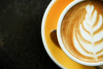 Coffee Latte leaf pattern face on black table