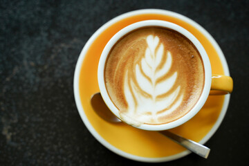 Coffee Latte leaf pattern face on black table