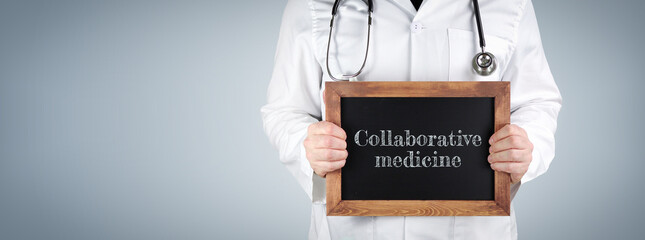 Collaborative medicine. Doctor shows term on a wooden sign.