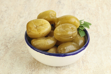 Pickled green tomato in the bowl