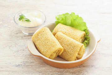 Stuffed pancakes with meat and cream