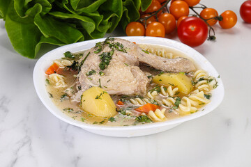 Chicken soup with leg and macaroni