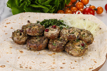 Baked mushroom champignon with sauce