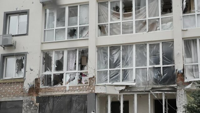 Aftermath shooting Ukraine shell civilian hitting building explosion glass. Shatter glass damage Ukraine war destruction building damage. Crash glass broken window house destroy building window crack
