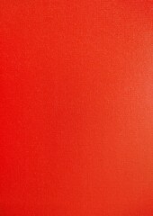 Textured canvas painted bright red for decorative background, textured canvas painted bright red background.