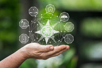 Technology, hand holding with environment Icons over the Network connection on green background
