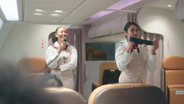 Air hostesses are demonstrating how to use the equipment on board passenger planes.