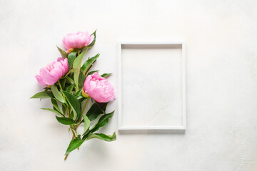 Pink peony Flowers in a frame on a bright background. Top view. Flat lay