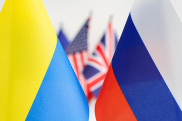State flag of Russia and Ukraine. UK and USA flags on background. Russian Ukrainian war conflict