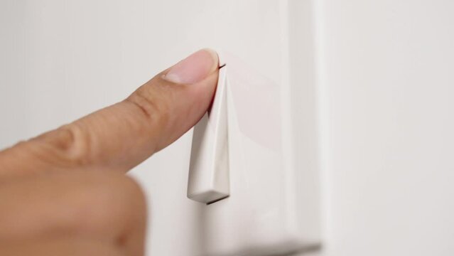 Finger pushing light switch turn on and turn off Saving electrical energy