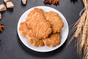 Homemade corn cookies on a dark concrete background