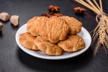 Homemade corn cookies on a dark concrete background