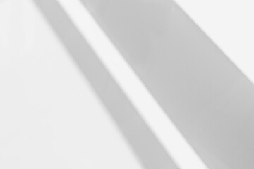 Gray shadow and light blur abstract background on white wall  from window.  Architecture stripe dark shadows indoor in room  background, shadow overlay effect