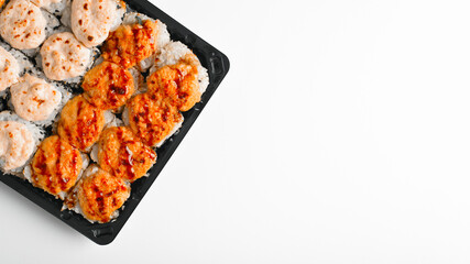 Delivery baked hot rolls set on white table. Japanese traditional food, asian food banner with copy space. Top view, close-up