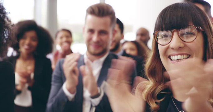 Now that's a positive response. Group of young diverse confident happy business people clapping, applauding company success, achievement while attending a training workshop seminar in conference room