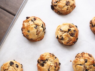 Top view baked raisin scones on baking tray