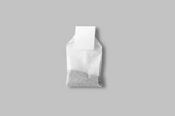 Tea packaging. Blank white paper box, cardboard container full of rectangular tea bags with label tag mockup isolated on white background. disposable tea bag isolated. 3d rendering.