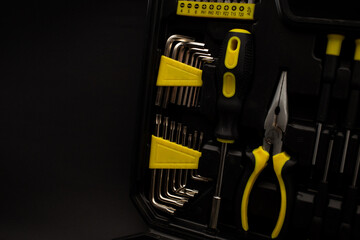 Fototapeta premium Toolbox, various devices and sizes, on black background, detailed shot