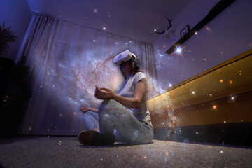 Woman uses virtual reality glasses to relax and meditate. Elements of this image furnished by NASA.