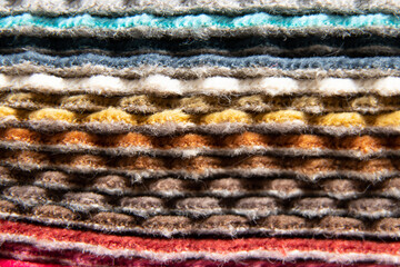 Fototapeta premium Catalog of different colors of fabrics for the client's choice for upholstery, examples of multi-colored fabrics as a background, fashion fabrics in the atelier