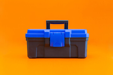 black blue toolbox with orange background