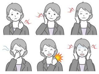 色々な部分が痛むスーツの高齢女性