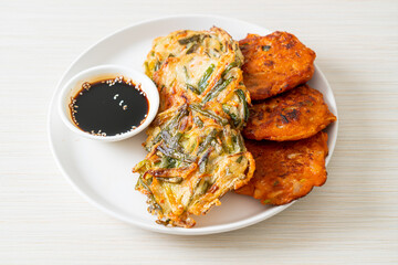 Pajeon or Korean pancake and Korean Kimchi pancake or Kimchijeon on white background
