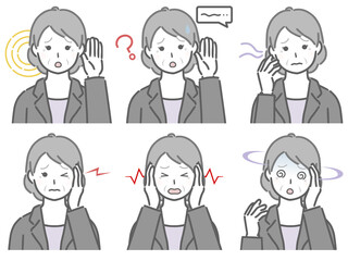 耳の調子が悪いスーツの高齢女性