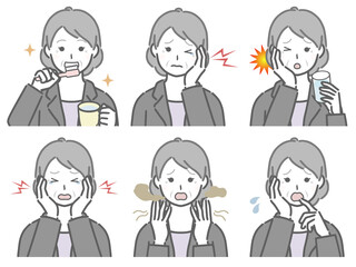 口の中に異常があるスーツの高齢女性