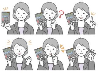 電卓を手に持つスーツの高齢女性