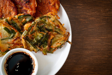 Pajeon or Korean pancake and Korean Kimchi pancake or Kimchijeon on white background