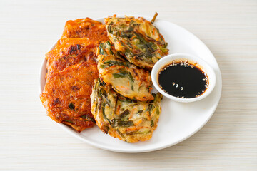 Pajeon or Korean pancake and Korean Kimchi pancake or Kimchijeon on white background
