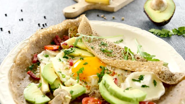 buckwheat crepe with egg, cheese and avocado