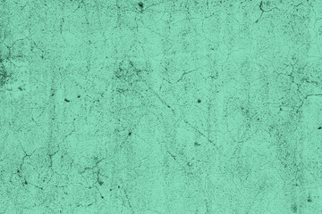 Scattered grunge textured teal color old concrete wall for background